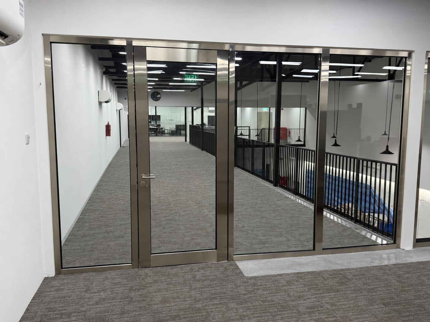 Corridor screen: fire-rated glass with stainless capping finish